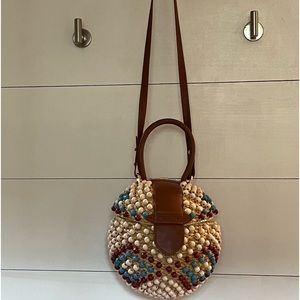 Poolside NY new straw/wooden bead leather bag